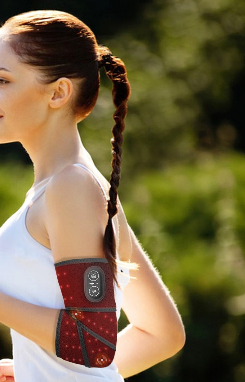 EmberWrap™ Cordless Red Light & Heat Wrap worn on the arm outdoors