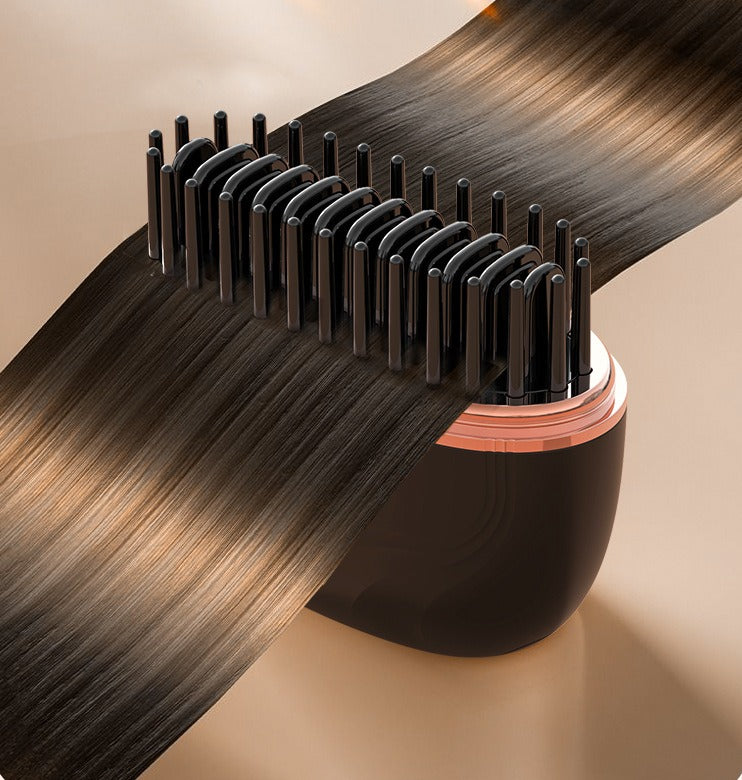 SleekPod heated bristles gliding through a strand of smooth brown hair